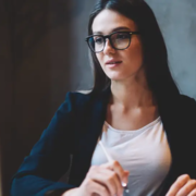 Young recruiter scheduling a franchisee candidate on her computer.